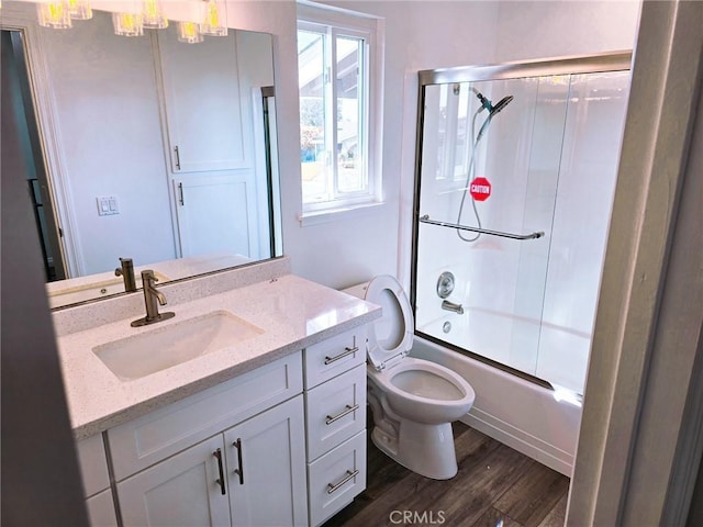 10672 Finch Ave, Rancho Cucamonga, CA 91737 - full bathroom with vanity, bath / shower combo with glass door, and wood finished floors