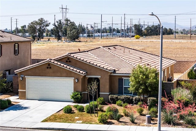 28420 Abbey Ln, Menifee, CA 92585 - view of front of property with stucco siding, concrete driveway, a garage, and a tiled roof