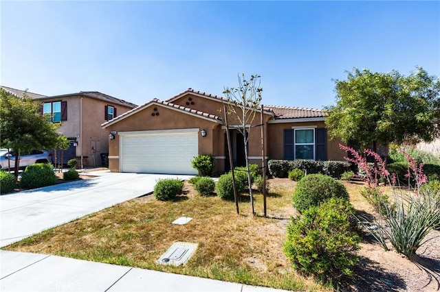 28420 Abbey Ln, Menifee, CA 92585 - view of front of home with stucco siding, concrete driveway, a garage, and a tile roof