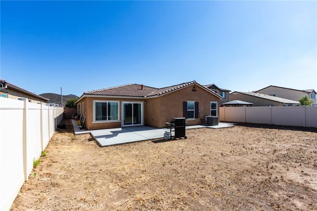 28420 Abbey Ln, Menifee, CA 92585 - rear view of house with a tiled roof, stucco siding, a patio, and a fenced backyard