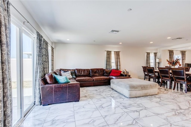 28420 Abbey Ln, Menifee, CA 92585 - living room with healthy amount of natural light, light marble finish floors, and recessed lighting