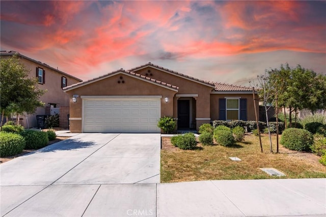 28420 Abbey Ln, Menifee, CA 92585 - mediterranean / spanish-style house with stucco siding, concrete driveway, a garage, and a tiled roof