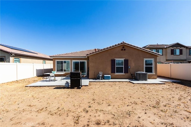 28420 Abbey Ln, Menifee, CA 92585 - back of property featuring stucco siding, a tile roof, a patio area, and a fenced backyard