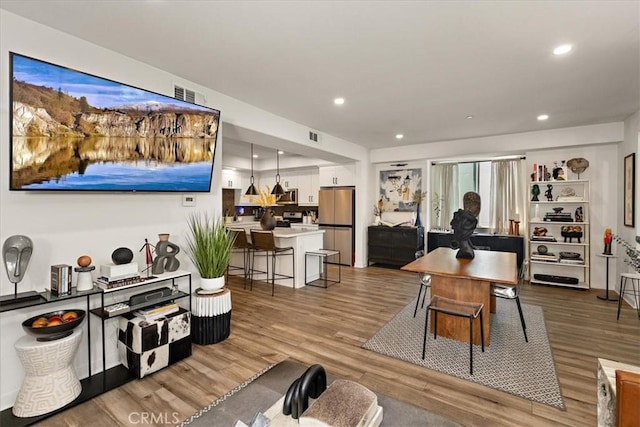 9384 Calm Water Pl, Rancho Cucamonga, CA 91730 - living area featuring wood finished floors and recessed lighting