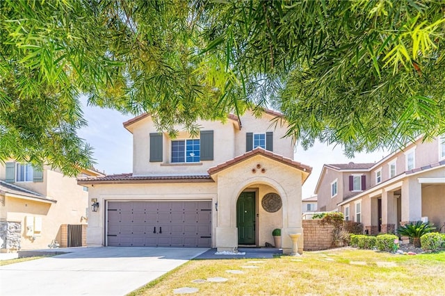 3867 Taconite Rd, San Bernardino, CA 92407 - mediterranean / spanish house with concrete driveway, an attached garage, stucco siding, and a tile roof