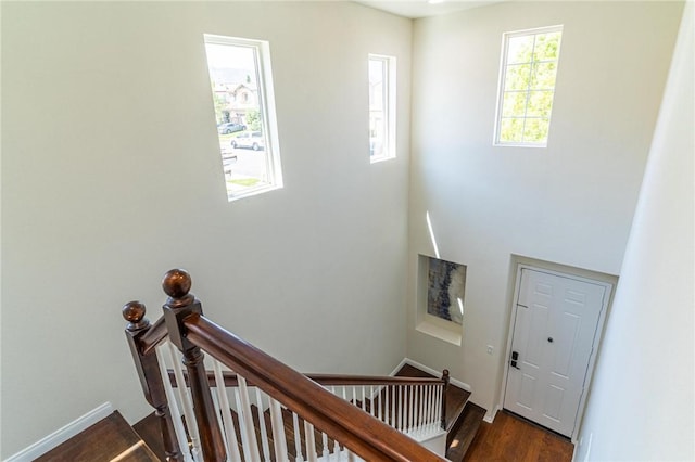 3867 Taconite Rd, San Bernardino, CA 92407 - stairs featuring wood finished floors