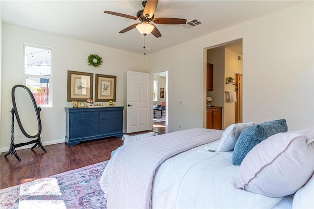 3867 Taconite Rd, San Bernardino, CA 92407 - bedroom featuring dark wood-style flooring, ceiling fan, and connected bathroom