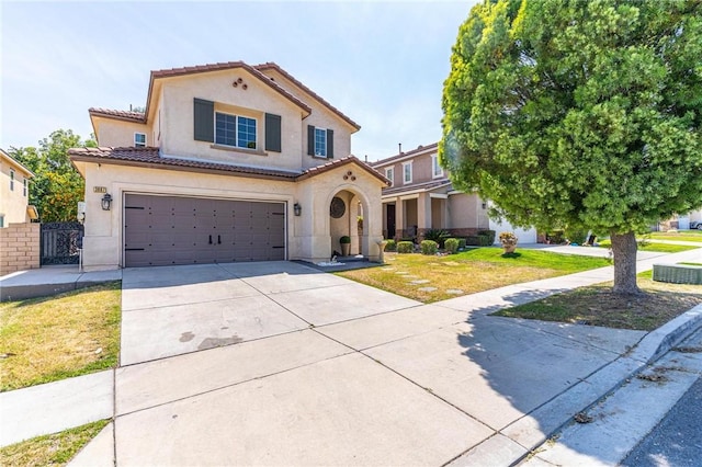 3867 Taconite Rd, San Bernardino, CA 92407 - mediterranean / spanish-style house with stucco siding, driveway, an attached garage, and a tile roof
