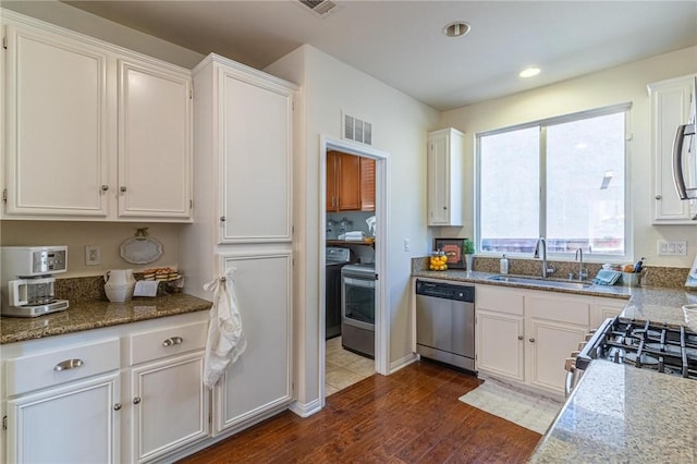 3867 Taconite Rd, San Bernardino, CA 92407 - kitchen with appliances with stainless steel finishes, white cabinets, dark wood-style floors, stone counters, and recessed lighting