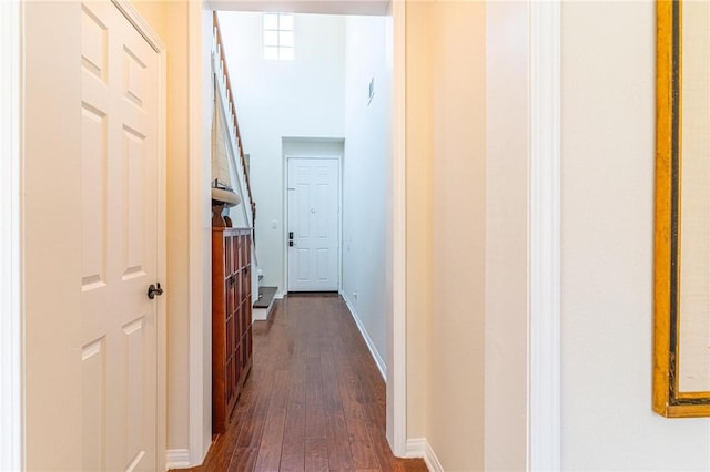 3867 Taconite Rd, San Bernardino, CA 92407 - hallway featuring dark wood-type flooring and baseboards