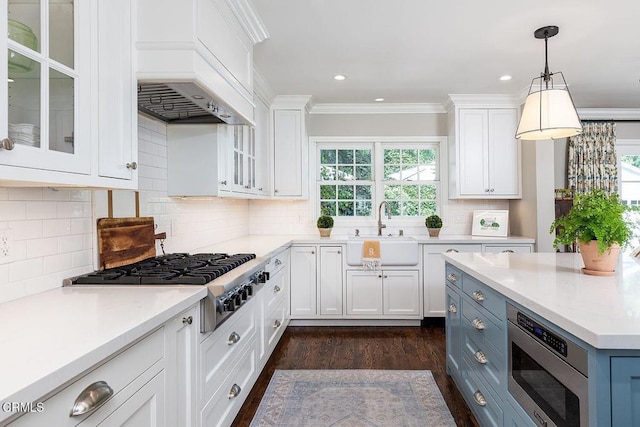 232 Glen Summer Rd, Pasadena, CA 91105 - kitchen with stainless steel appliances, white cabinetry, dark wood-style floors, glass insert cabinets, and hanging light fixtures