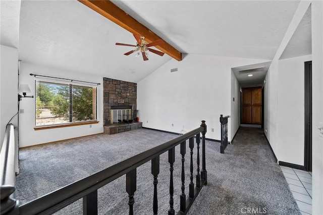 18969 Shoshonee Rd, Apple Valley, CA 92307 - unfurnished living room featuring carpet floors, ceiling fan, and a stone fireplace