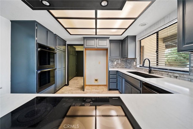 18969 Shoshonee Rd, Apple Valley, CA 92307 - kitchen featuring black appliances, light countertops, and decorative backsplash