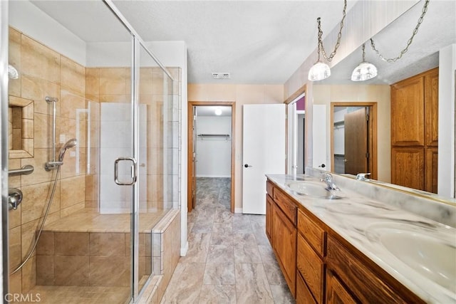 18969 Shoshonee Rd, Apple Valley, CA 92307 - bathroom with a stall shower, double vanity, and marble finish floors