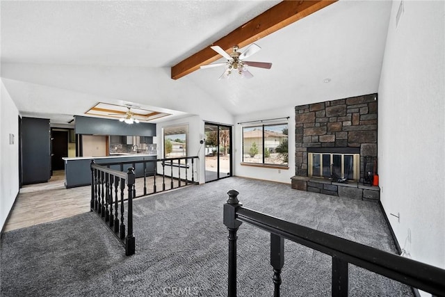 18969 Shoshonee Rd, Apple Valley, CA 92307 - living area with ceiling fan, light colored carpet, and a fireplace