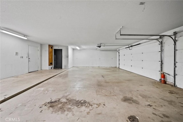 18969 Shoshonee Rd, Apple Valley, CA 92307 - garage featuring a garage door opener