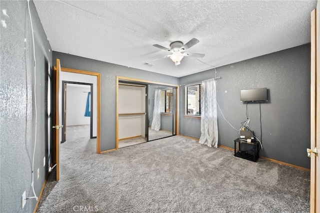 18969 Shoshonee Rd, Apple Valley, CA 92307 - unfurnished bedroom featuring carpet, a textured ceiling, a closet, a ceiling fan, and a textured wall