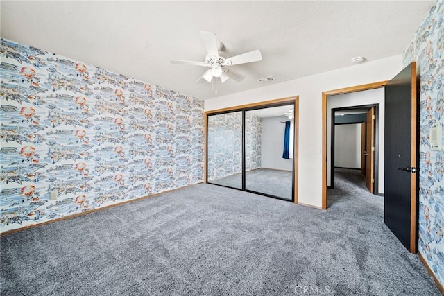 18969 Shoshonee Rd, Apple Valley, CA 92307 - unfurnished bedroom with carpet flooring, wallpapered walls, a closet, and a ceiling fan