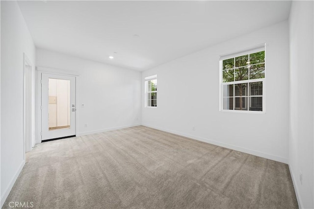 1042 N Anaheim Blvd Unit 2, Anaheim, CA 92801 - empty room featuring carpet floors, healthy amount of natural light, and recessed lighting