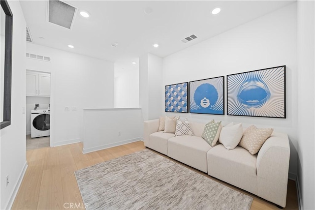 1042 N Anaheim Blvd Unit 2, Anaheim, CA 92801 - living room featuring washer / dryer, light wood-style flooring, and recessed lighting
