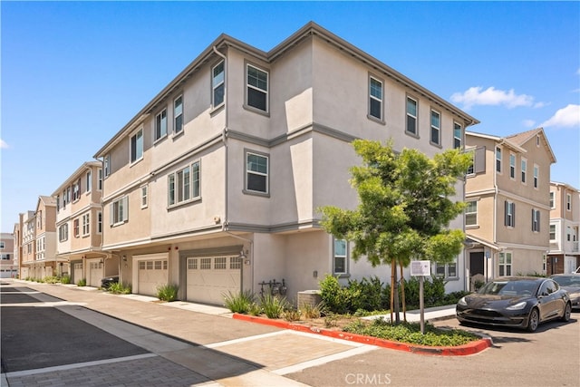 1042 N Anaheim Blvd Unit 2, Anaheim, CA 92801 - view of building exterior featuring an attached garage and a residential view