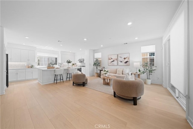 1042 N Anaheim Blvd Unit 2, Anaheim, CA 92801 - living area featuring light wood-style floors, healthy amount of natural light, and recessed lighting