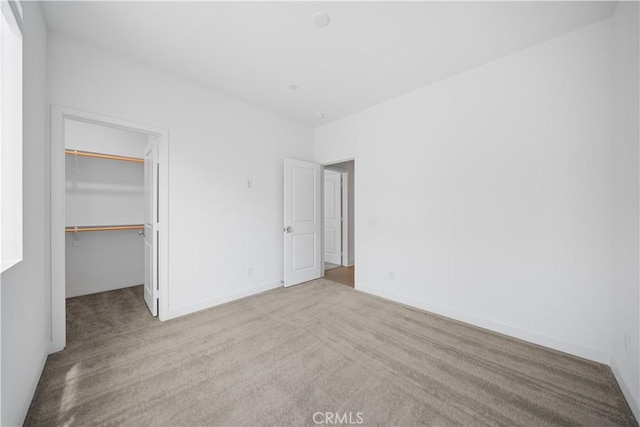 1042 N Anaheim Blvd Unit 2, Anaheim, CA 92801 - unfurnished bedroom featuring carpet floors, a spacious closet, and a closet