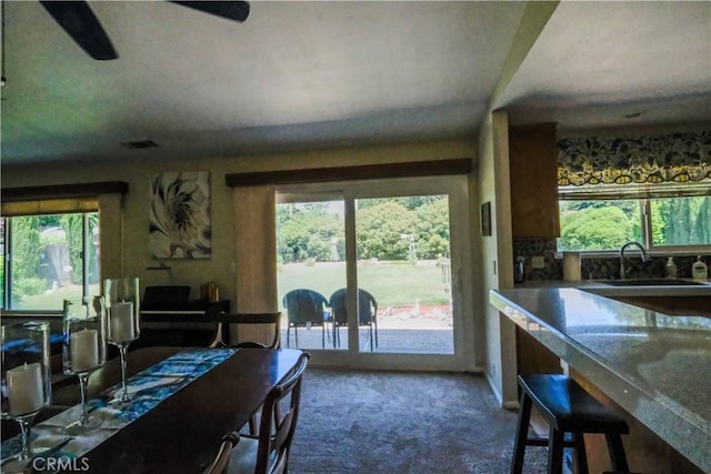 3376 Hackamore Ln, Chico, CA 95973 - carpeted dining space with healthy amount of natural light and french doors