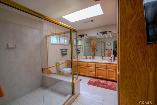 3376 Hackamore Ln, Chico, CA 95973 - bathroom with a skylight, tile patterned flooring, a shower stall, and double vanity