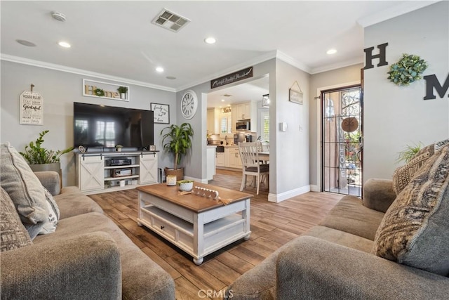340 N Sunset Ave, West Covina, CA 91790 - living area featuring wood finished floors, crown molding, and recessed lighting