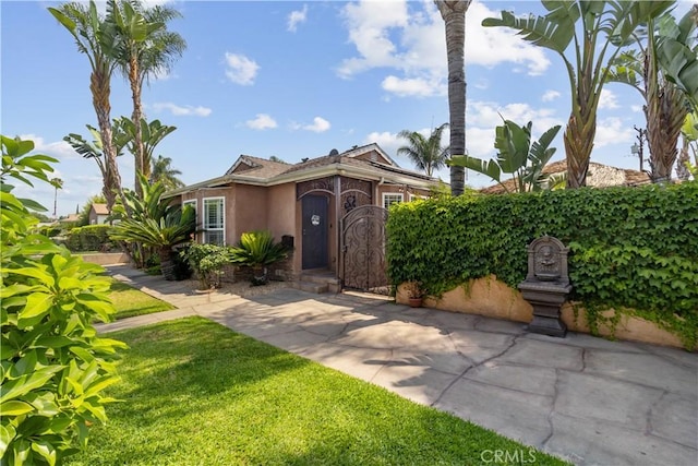 340 N Sunset Ave, West Covina, CA 91790 - view of front facade featuring stucco siding and a front yard