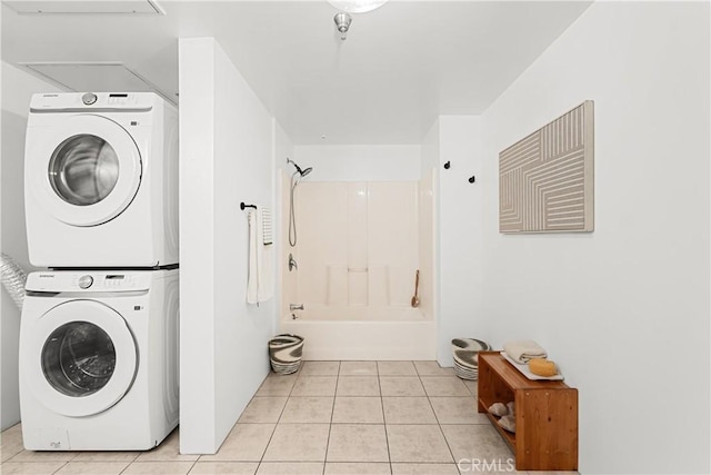 200 N San Fernando Rd Unit 202, Los Angeles, CA 90031 - washroom featuring stacked washer and clothes dryer, attic access, and light tile patterned floors