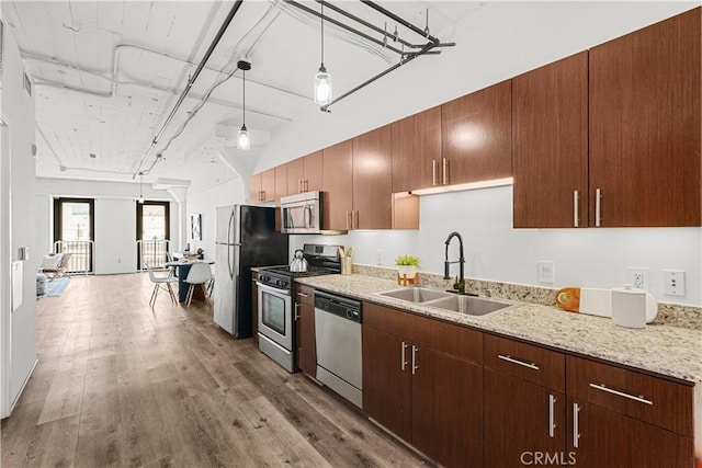 200 N San Fernando Rd Unit 202, Los Angeles, CA 90031 - kitchen with stainless steel appliances, wood finished floors, decorative light fixtures, and light stone counters