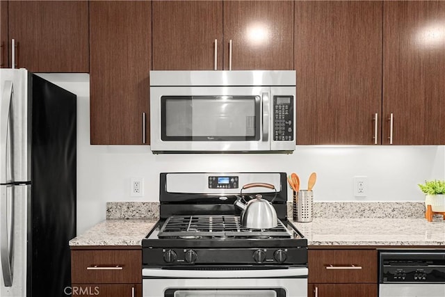 200 N San Fernando Rd Unit 202, Los Angeles, CA 90031 - kitchen featuring appliances with stainless steel finishes, dark brown cabinets, and light stone countertops