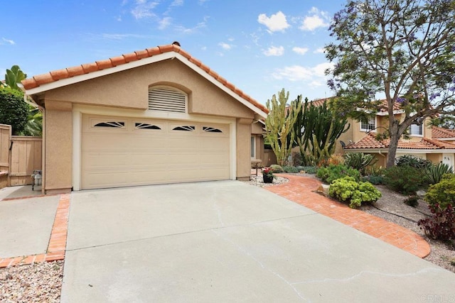 1642 Marbella Dr, Vista, CA 92081 - view of front of home with stucco siding, concrete driveway, and a tiled roof