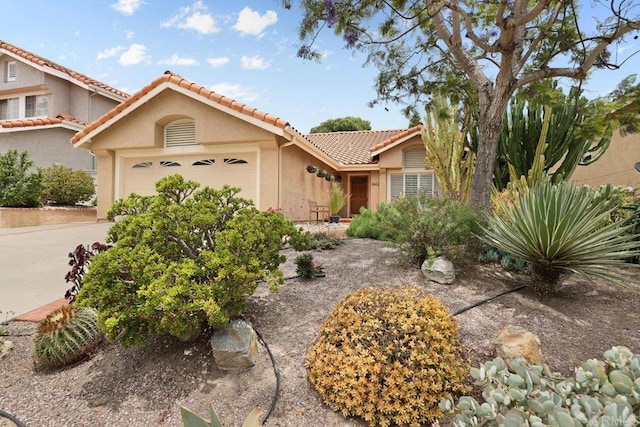 1642 Marbella Dr, Vista, CA 92081 - view of front of home featuring stucco siding, a garage, and a tile roof