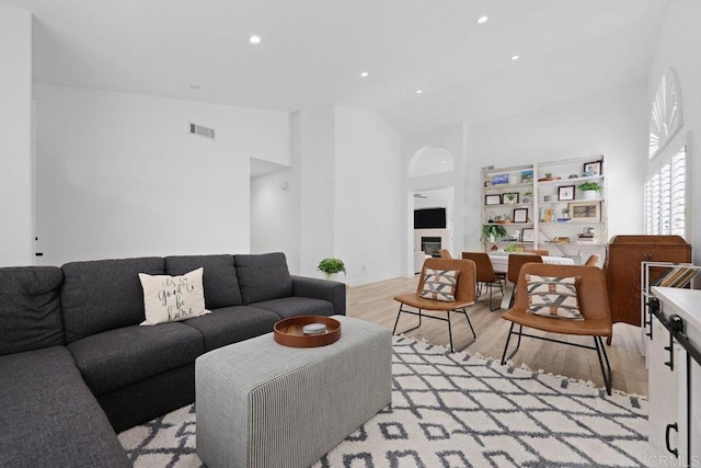 1642 Marbella Dr, Vista, CA 92081 - living area with light wood-style flooring, high vaulted ceiling, and recessed lighting