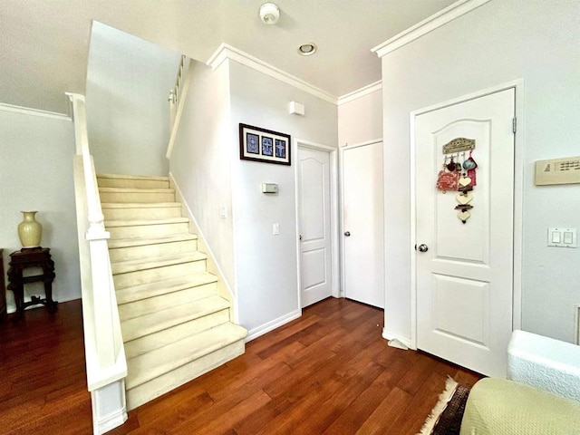 13638 Jadestone Way, San Diego, CA 92130 - entryway featuring ornamental molding, stairway, and dark wood-style floors
