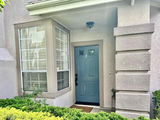 13638 Jadestone Way, San Diego, CA 92130 - doorway to property featuring stucco siding