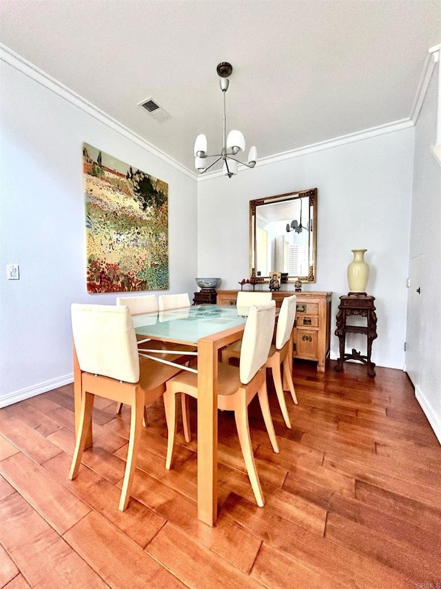 13638 Jadestone Way, San Diego, CA 92130 - dining room featuring crown molding, a chandelier, and light wood-type flooring