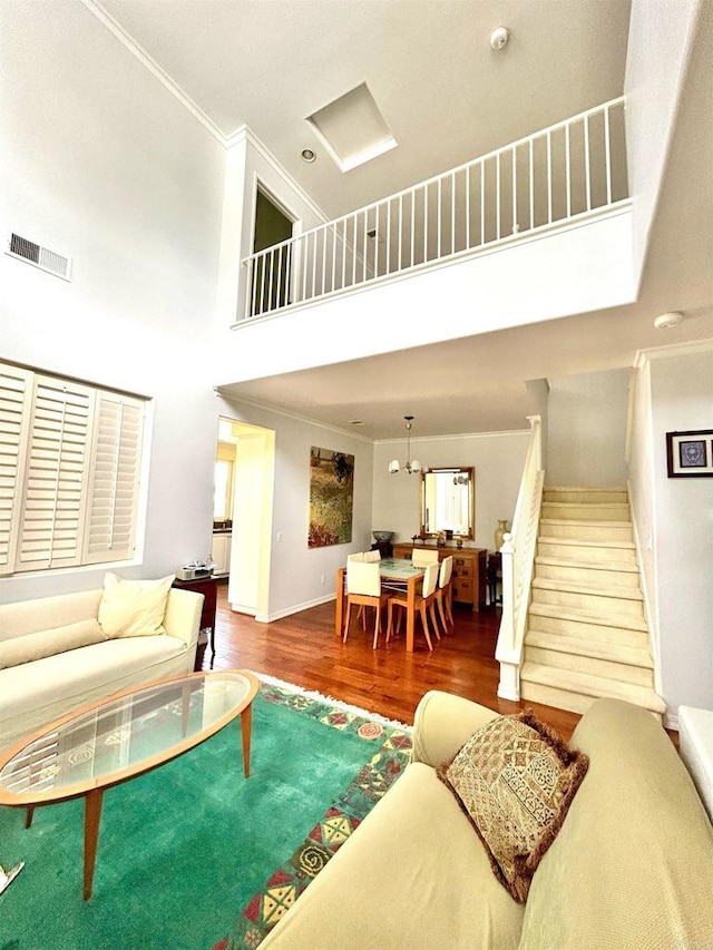 13638 Jadestone Way, San Diego, CA 92130 - living area featuring a high ceiling, stairway, wood finished floors, and ornamental molding
