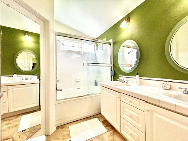 13638 Jadestone Way, San Diego, CA 92130 - bathroom with lofted ceiling, enclosed tub / shower combo, double vanity, and marble finish flooring