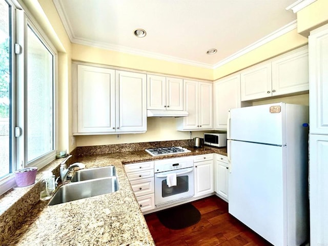 13638 Jadestone Way, San Diego, CA 92130 - kitchen with white appliances, under cabinet range hood, ornamental molding, white cabinets, and dark wood finished floors