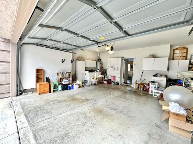 13638 Jadestone Way, San Diego, CA 92130 - garage with a garage door opener and freestanding refrigerator