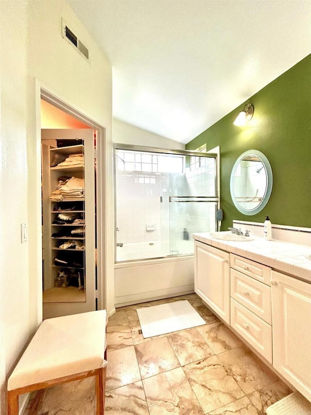 13638 Jadestone Way, San Diego, CA 92130 - full bath featuring vaulted ceiling, combined bath / shower with glass door, and vanity