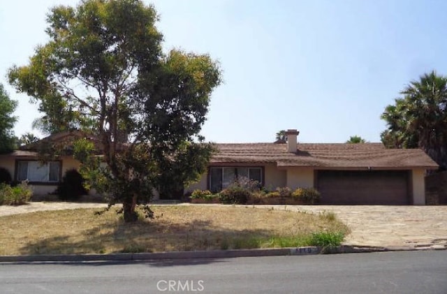 1119 Paseo Grande, Corona, CA 92882 - ranch-style house with a garage, concrete driveway, and stucco siding