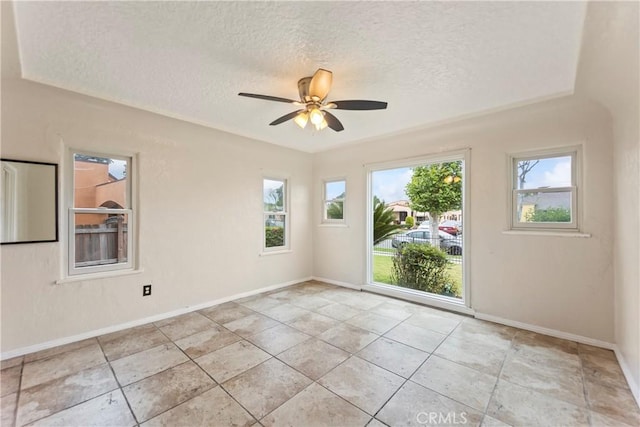 621 S Burris Ave, Compton, CA 90221 - spare room with a textured ceiling, a ceiling fan, and light tile patterned flooring