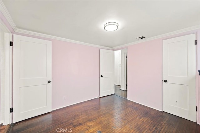 621 S Burris Ave, Compton, CA 90221 - unfurnished bedroom featuring dark wood-style floors and ornamental molding