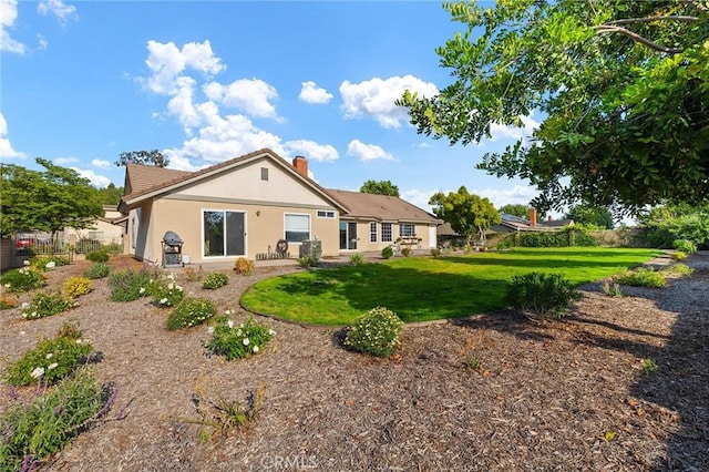 323 N Hacienda Ave, Glendora, CA 91741 - back of property with a lawn, a chimney, and stucco siding