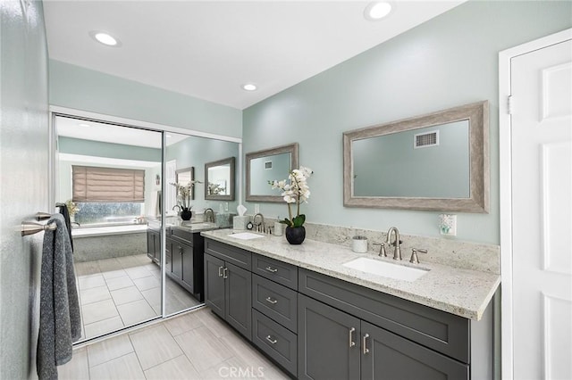 323 N Hacienda Ave, Glendora, CA 91741 - full bathroom featuring double vanity, a bath, and recessed lighting
